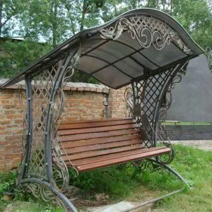 кованая качель Марсель Арт 12 с крышей из поликарбоната СПб Мастерская художественной ковки Золотая ПодКовка
